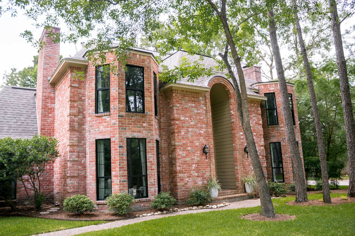 Black frame windows on brick home in Houston TX